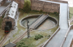 The turntable is in the crook of the approach road to the station.