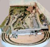 Looking along the layout, showing the temporary "D" tracks and the buildings covering the servo electronics and the holding storage tracks.