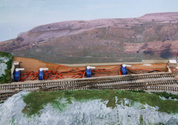 Servo motors for operating the cross-over points for access to main sidings from the main line.