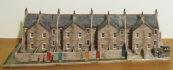 This module is of eight terrace houses. It is in on the right of the middle ground, over the servo motors and control units for the points & track sensors.
